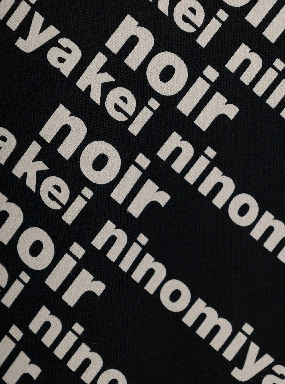 Comme Des Garons Noir Kei Ninomiya Allover Logo Print T-Shirt